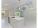 Open concept kitchen with white cabinets and large island at 7648 Totem Ave, North Port, FL 34291