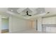 Bright hallway with doors to other rooms and wood floors at 7648 Totem Ave, North Port, FL 34291