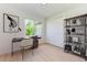 Home office with built in shelving and large window at 7648 Totem Ave, North Port, FL 34291