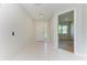 Bright entryway with white door and light flooring at 7648 Totem Ave, North Port, FL 34291