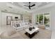 Bright living room with open floor plan, and view to backyard at 7648 Totem Ave, North Port, FL 34291