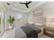 Spacious main bedroom with large bed, window, and neutral decor at 7648 Totem Ave, North Port, FL 34291