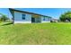 House exterior showcasing backyard and landscaping at 7648 Totem Ave, North Port, FL 34291