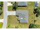Aerial view showing a single-Gathering home with a paved driveway at 7648 Totem Ave, North Port, FL 34291