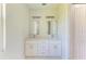 Double vanity bathroom with white cabinets and quartz countertop at 7648 Totem Ave, North Port, FL 34291