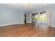 Light and airy living room with hardwood floors and access to backyard at 3725 70Th E Ave, Ellenton, FL 34222