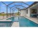 Relaxing pool and spa area with a covered lanai and water view at 109 Marker Rd, Rotonda West, FL 33947