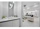 Modern powder room with floating vanity and marble floors at 109 Marker Rd, Rotonda West, FL 33947