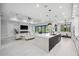 Bright and airy living space flows seamlessly into the kitchen and dining area, perfect for entertaining at 109 Marker Rd, Rotonda West, FL 33947