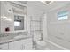 Bright bathroom with granite countertop, updated vanity, and bathtub at 117 Villa Dr # 117, Osprey, FL 34229