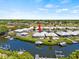 Aerial view of waterfront property with boat slips at 117 Villa Dr # 117, Osprey, FL 34229