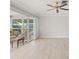 Living room with sliding glass doors to a patio at 117 Villa Dr # 117, Osprey, FL 34229