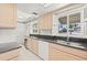 Kitchen with granite countertops and water views at 117 Villa Dr # 117, Osprey, FL 34229