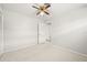 Spacious bedroom with neutral walls, carpeted floor, and ceiling fan at 117 Villa Dr # 117, Osprey, FL 34229