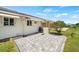 Private patio with paver stones and outdoor grill at 117 Villa Dr # 117, Osprey, FL 34229