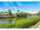 Scenic waterfront property with lush vegetation and a dock at 117 Villa Dr # 117, Osprey, FL 34229