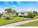 Well maintained lawn, walkway, and attractive landscaping at 117 Villa Dr # 117, Osprey, FL 34229