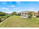 Landscaped backyard with a patio and water view at 117 Villa Dr # 117, Osprey, FL 34229