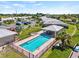 Community pool and lush landscaping visible in this aerial view at 117 Villa Dr # 117, Osprey, FL 34229