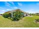 Ranch-style home with large windows and landscaping at 117 Villa Dr # 117, Osprey, FL 34229