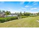 Peaceful canal-front view with lush landscaping and boat dock at 117 Villa Dr # 117, Osprey, FL 34229