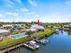 Waterfront property with private dock and community pool visible from above at 117 Villa Dr # 117, Osprey, FL 34229