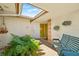 Charming courtyard with a bench and lush greenery at 117 Villa Dr # 117, Osprey, FL 34229