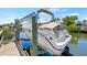 Boat on a lift at a private dock at 117 Villa Dr # 117, Osprey, FL 34229