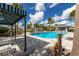 Community pool with lounge chairs and a shaded area at 14538 Barefoot Ln, Parrish, FL 34219