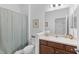 Clean bathroom with shower/tub combo and a vanity at 14538 Barefoot Ln, Parrish, FL 34219