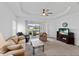 Bright living room with access to the backyard patio at 14538 Barefoot Ln, Parrish, FL 34219