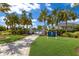 Leisure Cove community pool area with palm trees at 14538 Barefoot Ln, Parrish, FL 34219