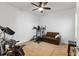 Home gym with exercise equipment and a comfortable couch at 14538 Barefoot Ln, Parrish, FL 34219