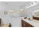 Elegant bathroom with a large walk-in shower and double vanity at 14538 Barefoot Ln, Parrish, FL 34219