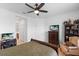 Spacious bedroom with large window, dresser, and seating area at 14538 Barefoot Ln, Parrish, FL 34219