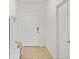 Clean entryway with tile floor, bench, and coat rack at 14538 Barefoot Ln, Parrish, FL 34219
