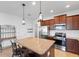 Modern kitchen with stainless steel appliances and granite countertops at 14538 Barefoot Ln, Parrish, FL 34219