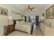 Spacious main bedroom with pool view and luxurious bedding at 1509 Raphis Royale Blvd, Englewood, FL 34223