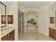 Spa-like bathroom with soaking tub, glass shower, and dual vanity at 1509 Raphis Royale Blvd, Englewood, FL 34223
