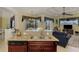 Granite kitchen island with sink and dishwasher, open to the Gathering room at 1509 Raphis Royale Blvd, Englewood, FL 34223