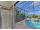 Outdoor shower near the screened pool and spa at 1509 Raphis Royale Blvd, Englewood, FL 34223