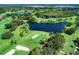 Aerial view of golf course and pond at 1509 Raphis Royale Blvd, Englewood, FL 34223