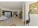 An entryway with a view into the living room and dining area at 1509 Raphis Royale Blvd, Englewood, FL 34223
