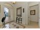 Elegant entryway with double doors and a decorative mirror at 1509 Raphis Royale Blvd, Englewood, FL 34223