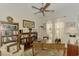 Home library with built-in bookshelves and comfortable seating at 1509 Raphis Royale Blvd, Englewood, FL 34223