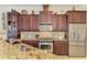 Modern kitchen with stainless steel appliances and granite countertops at 1509 Raphis Royale Blvd, Englewood, FL 34223
