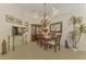 Elegant dining room, featuring a wood table and hutch at 1509 Raphis Royale Blvd, Englewood, FL 34223