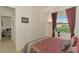 Bedroom with a queen bed, and access to another room at 1509 Raphis Royale Blvd, Englewood, FL 34223