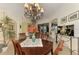 Well-lit dining area showcasing a lovely centerpiece at 1509 Raphis Royale Blvd, Englewood, FL 34223