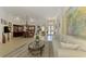 Spacious living room features ample natural light and comfortable seating at 1509 Raphis Royale Blvd, Englewood, FL 34223